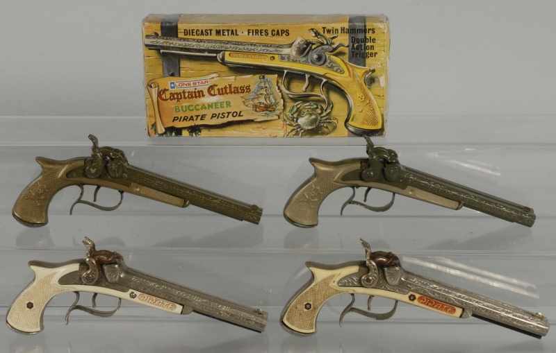 Appraisal: Lot of Cap Guns Description Includes two Hubley Pirates in