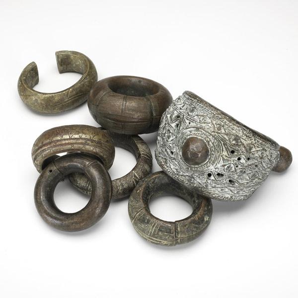 Appraisal: SEVEN AFRICAN BRONZE AND COPPER TRADE BRACLETS One from Cameroon