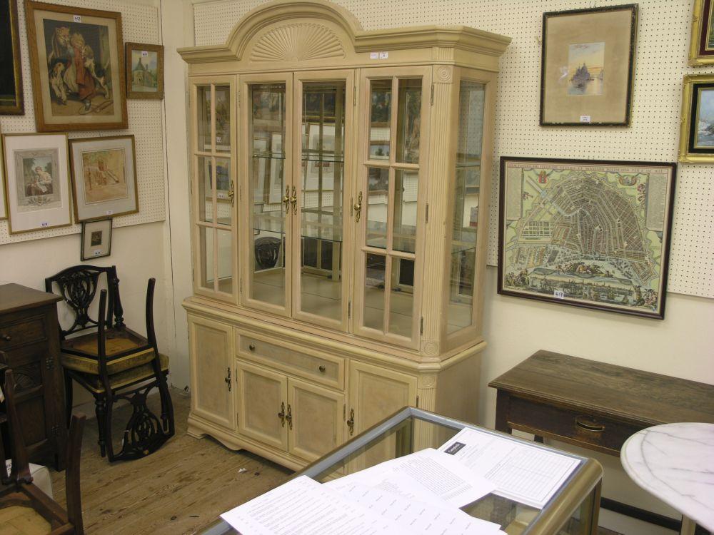 Appraisal: A large modern bleached walnut display cabinet mirrored upper stage