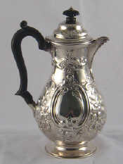 Appraisal: A late Victorian silver hot water jug of embossed baluster