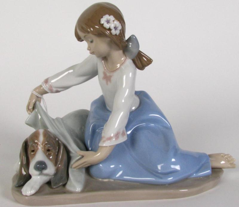 Appraisal: Lladro porcelain figurine ''Dog's Best Friend'' Height Length ''