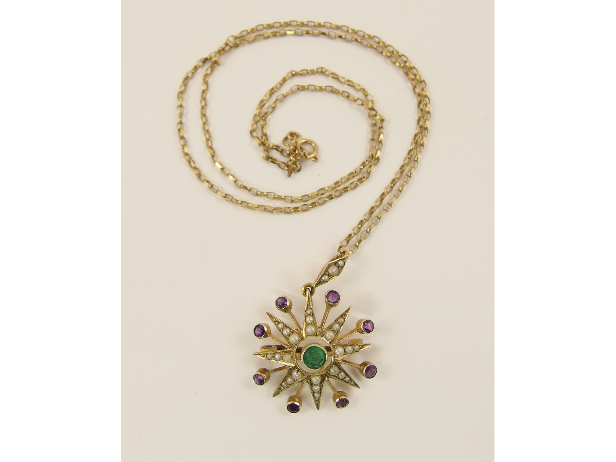 Appraisal: An Edwardian star shaped pendant brooch set with pearls amethyst