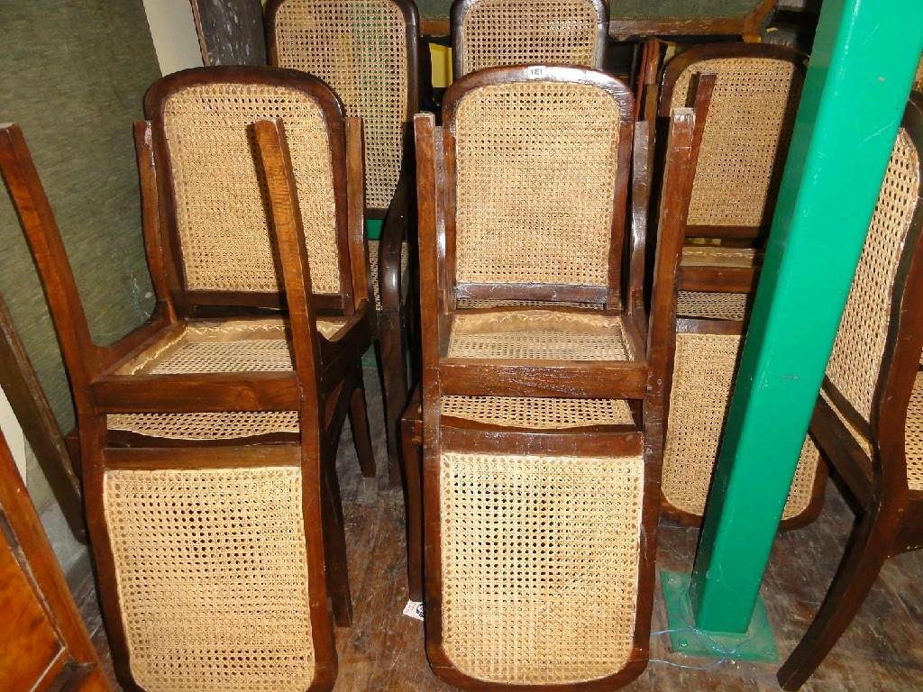 Appraisal: A set of twelve dining chairs with hardwood frames arched