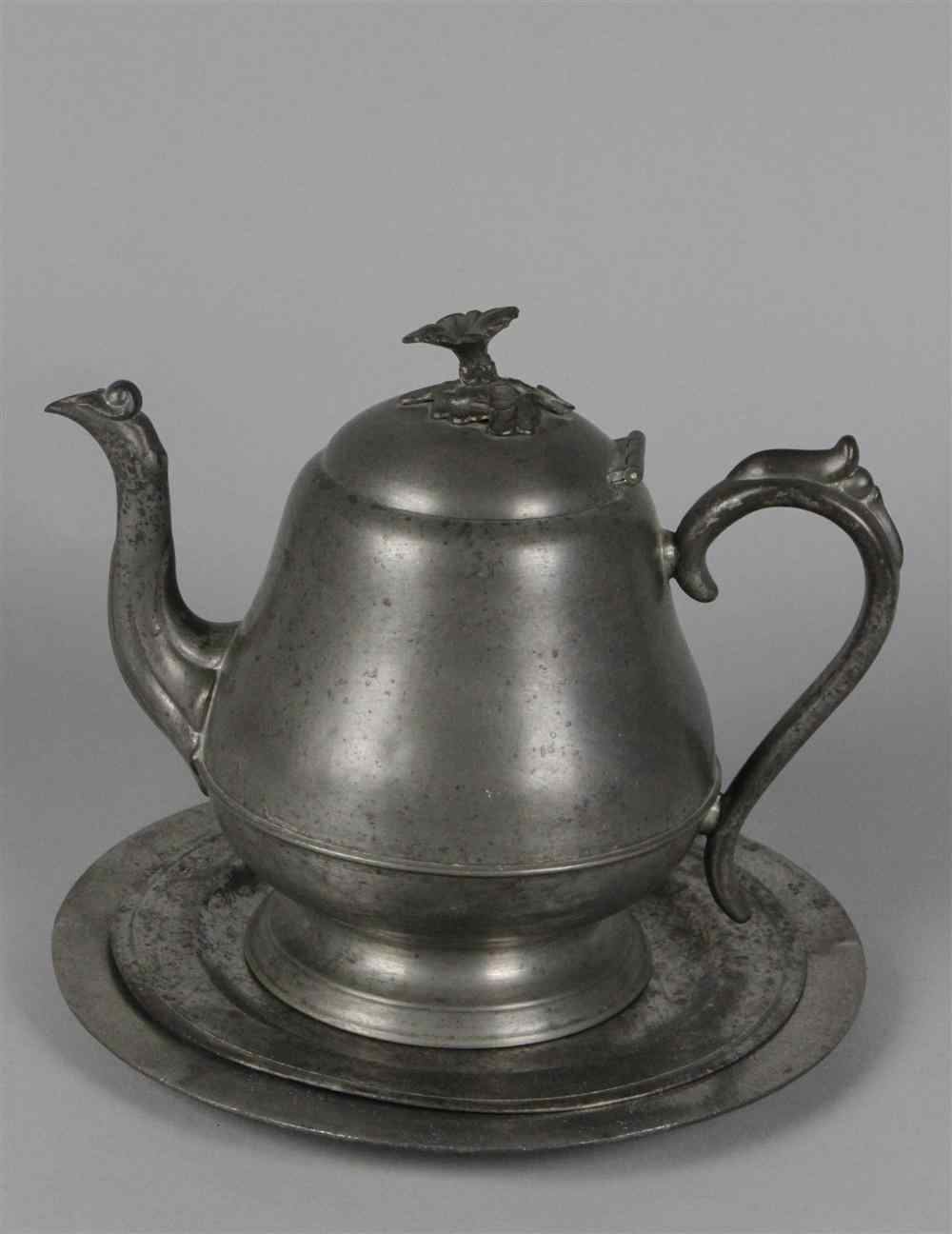 Appraisal: BRITANNIA METAL TEAPOT AND TWO PEWTER PLATES th century pear-shaped