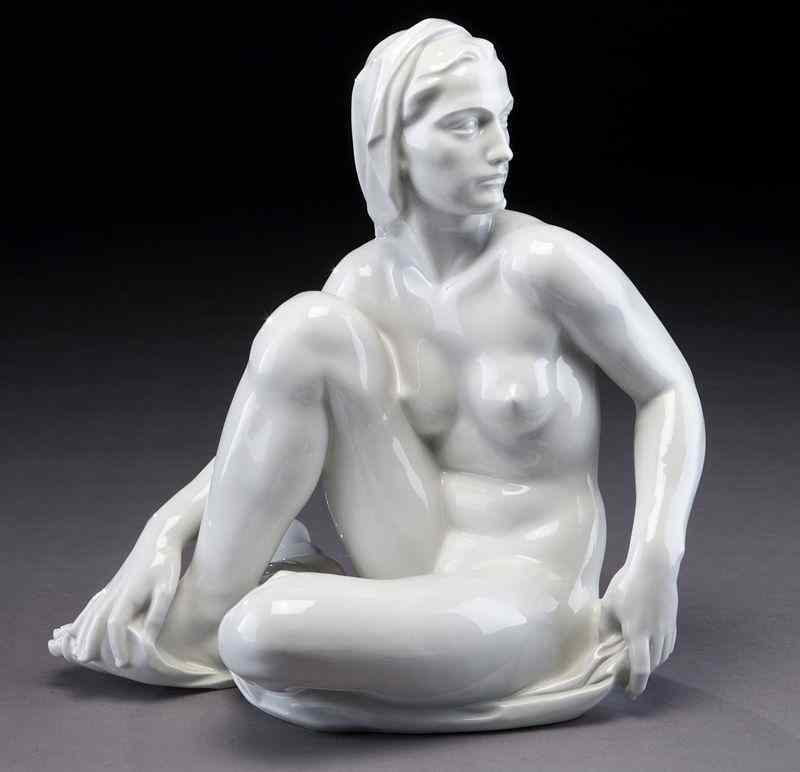 Appraisal: German white porcelain figure of a seated nudewith head scarf