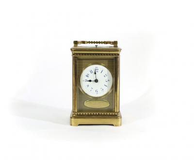 Appraisal: A Victorian gilt brass cased carriage clock with circular enamel