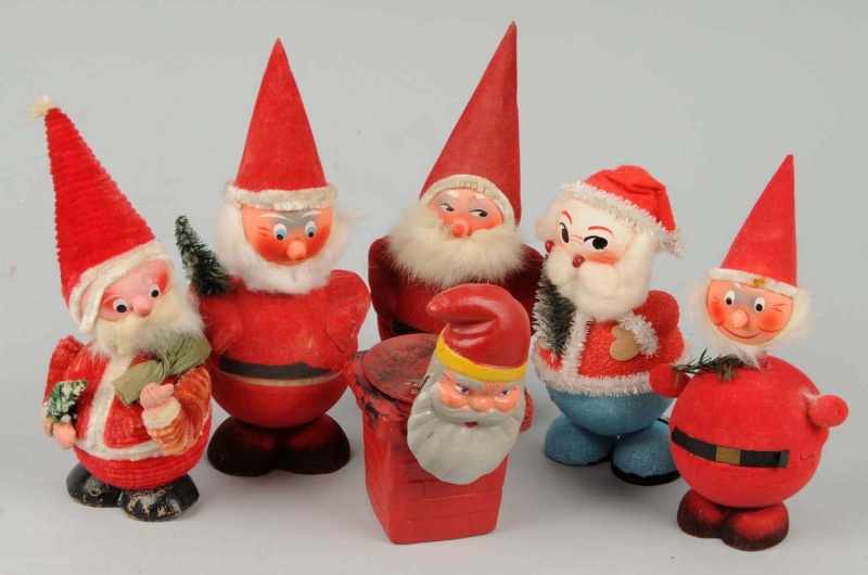 Appraisal: Lot of Christmas Santa Candy Containers Description Japanese Four are