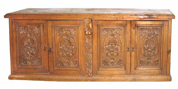 Appraisal: A Renaissance style carved mixed wood sideboard height in length