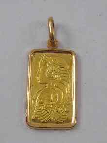 Appraisal: A fine gold ingot the suspension ring marked