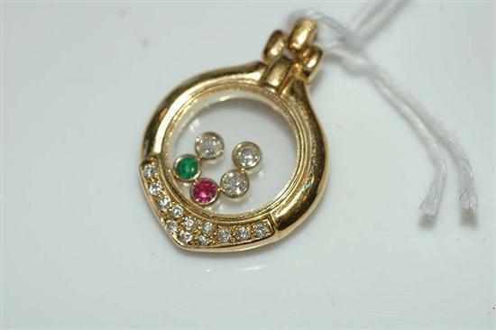 Appraisal: A DIAMOND EMERALD AND RUBY PENDANT IN THE STYLE OF