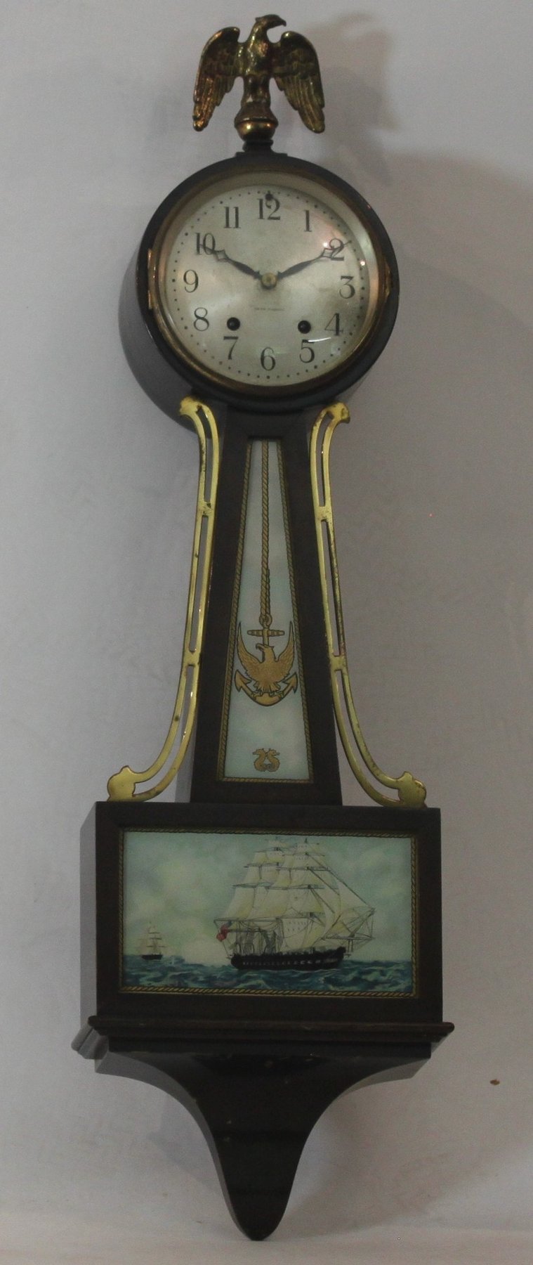 Appraisal: A th Century American wall clock with gilded eagle finial