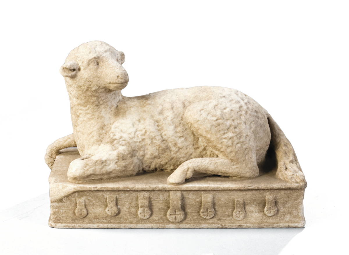 Appraisal: CARVED MARBLE SCULPTURE OF A RECUMBENT LAMB ON A BIBLE