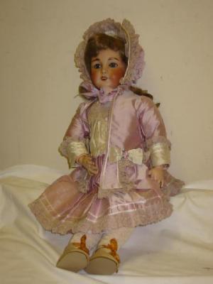 Appraisal: A Unis French bisque head girl doll with blue glass