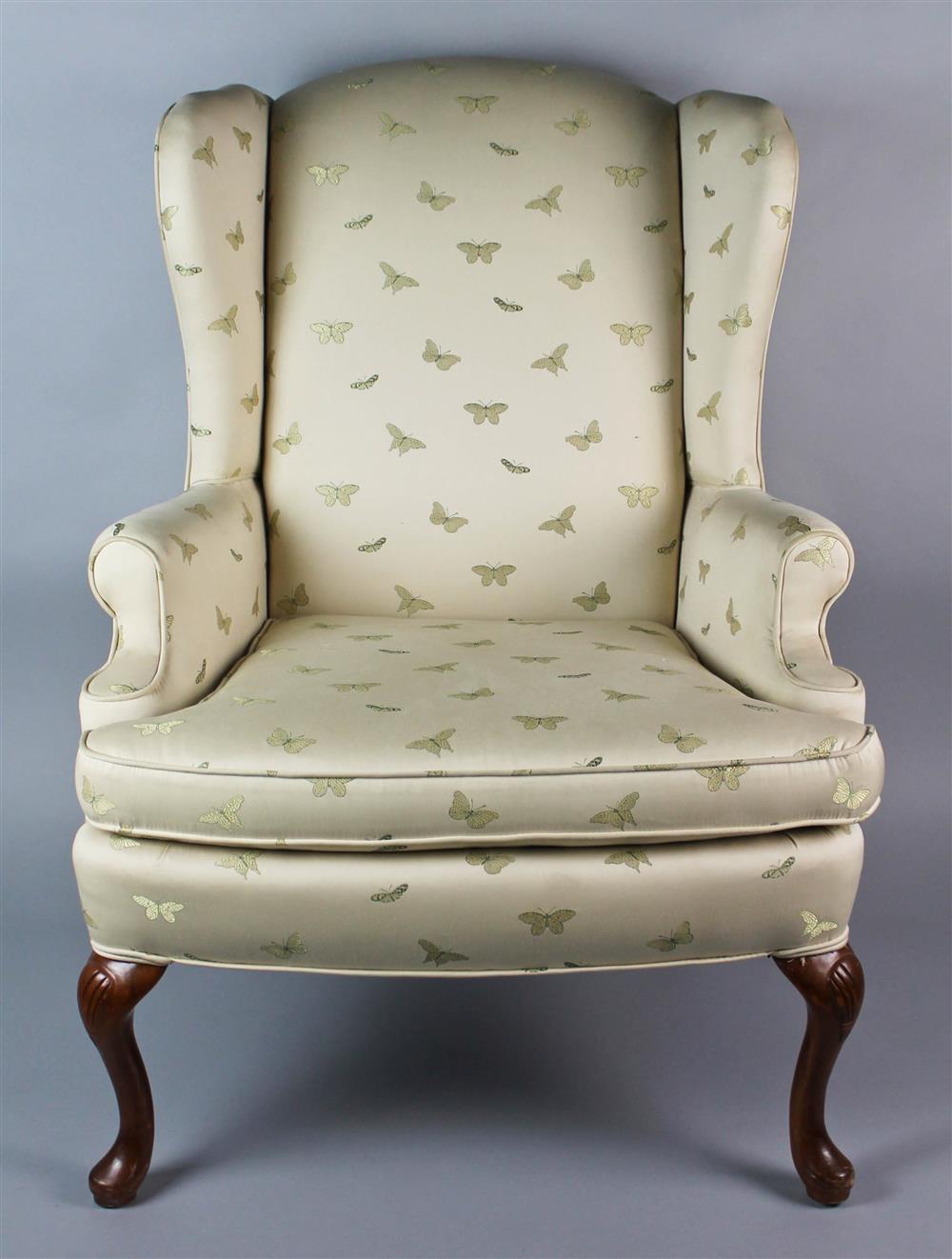 Appraisal: QUEEN ANNE STYLE UPHOLSTERED WING CHAIR arched back above a