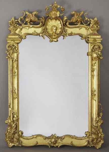 Appraisal: French carved gilt framed wall mirror the crest centered by