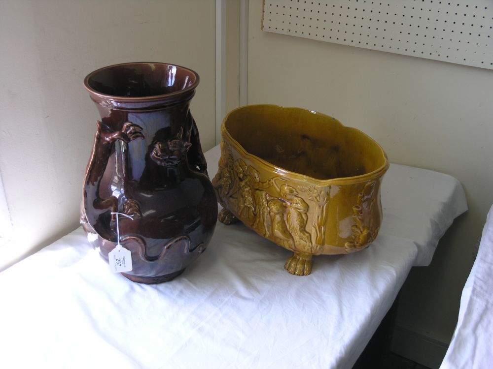 Appraisal: A Victorian brown glazed vase modelled with a dragon handle