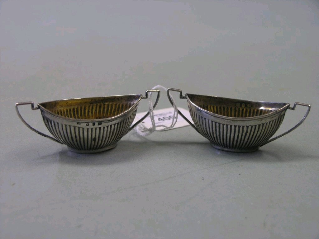 Appraisal: A pair of silver salts reeded form each with two