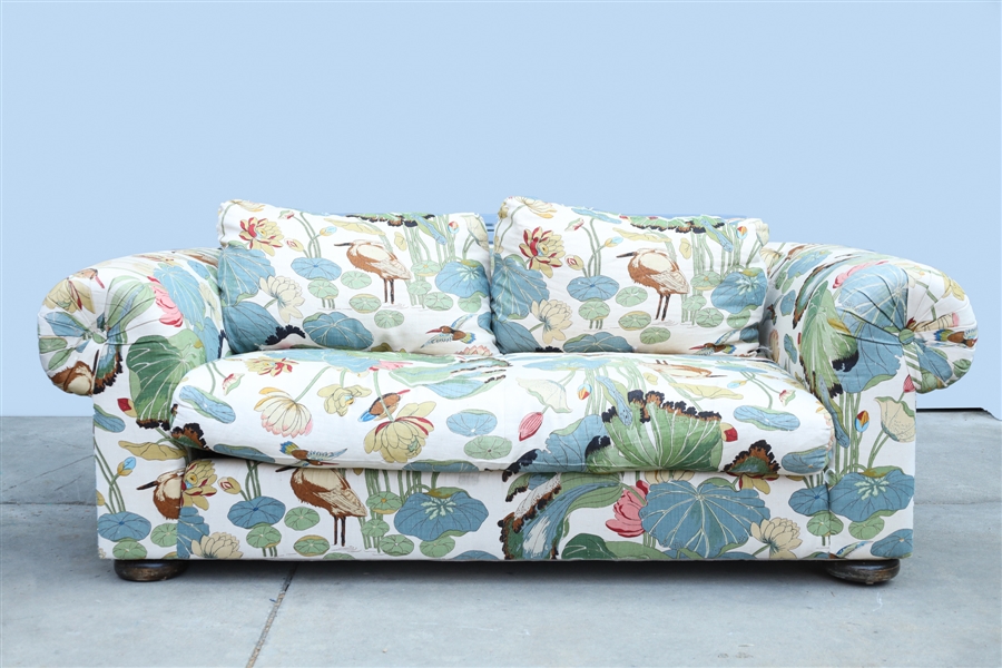 Appraisal: Sofa with two cushions depicting pond lily pads and birds