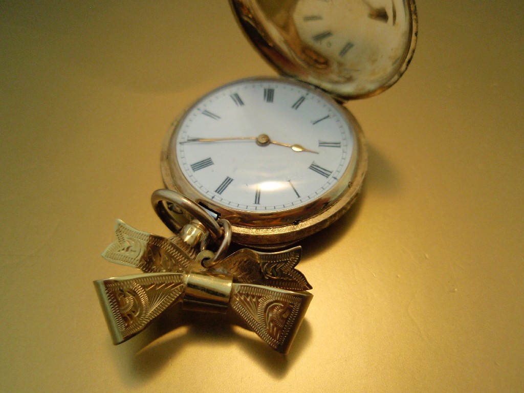 Appraisal: An ct gold cased hunter fob watch attached to a