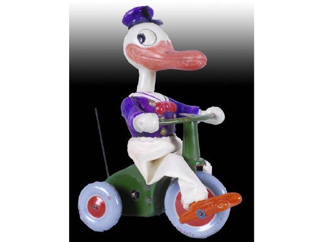 Appraisal: Walt Disney Celluloid Tin Donald Duck Tri-Cycle Description Wind-up Working