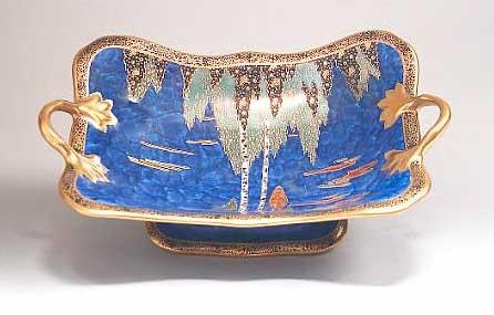 Appraisal: A Carltonware dish decorated with trees against a blue ground