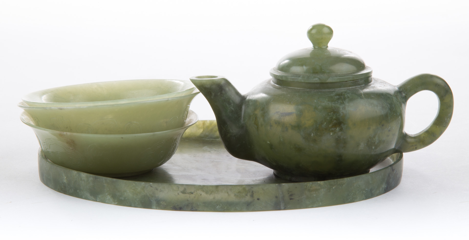 Appraisal: Chinese carved jade miniature tea set comprising teapot three tea