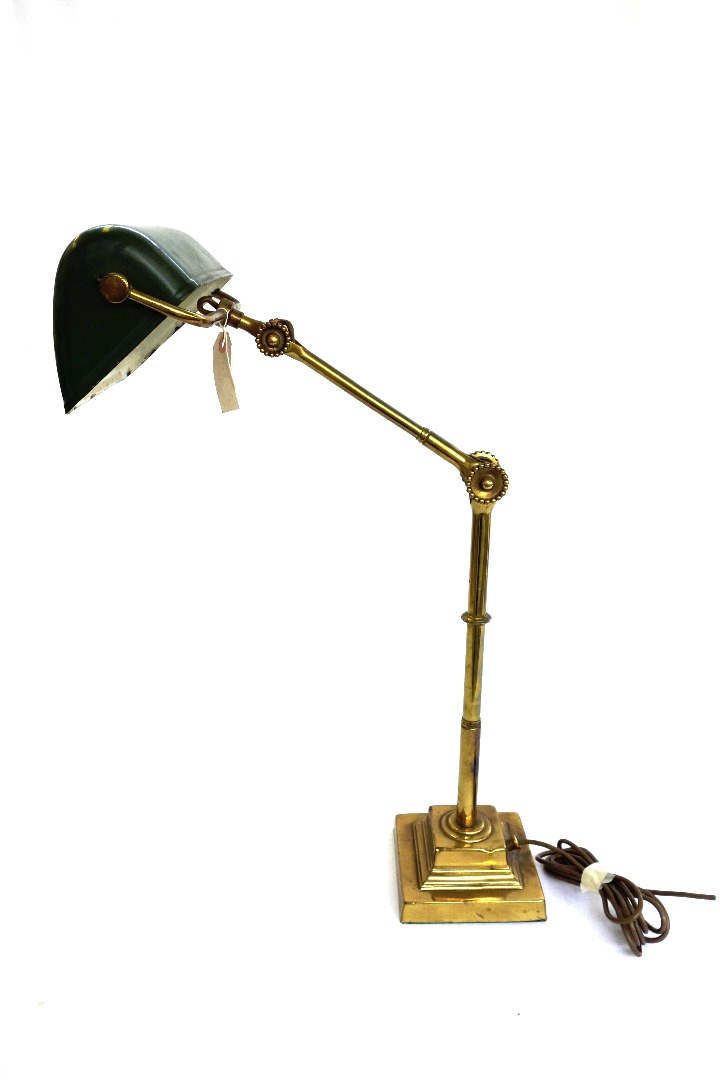 Appraisal: A Victorian brass and adjustable desk lamp with green enamel