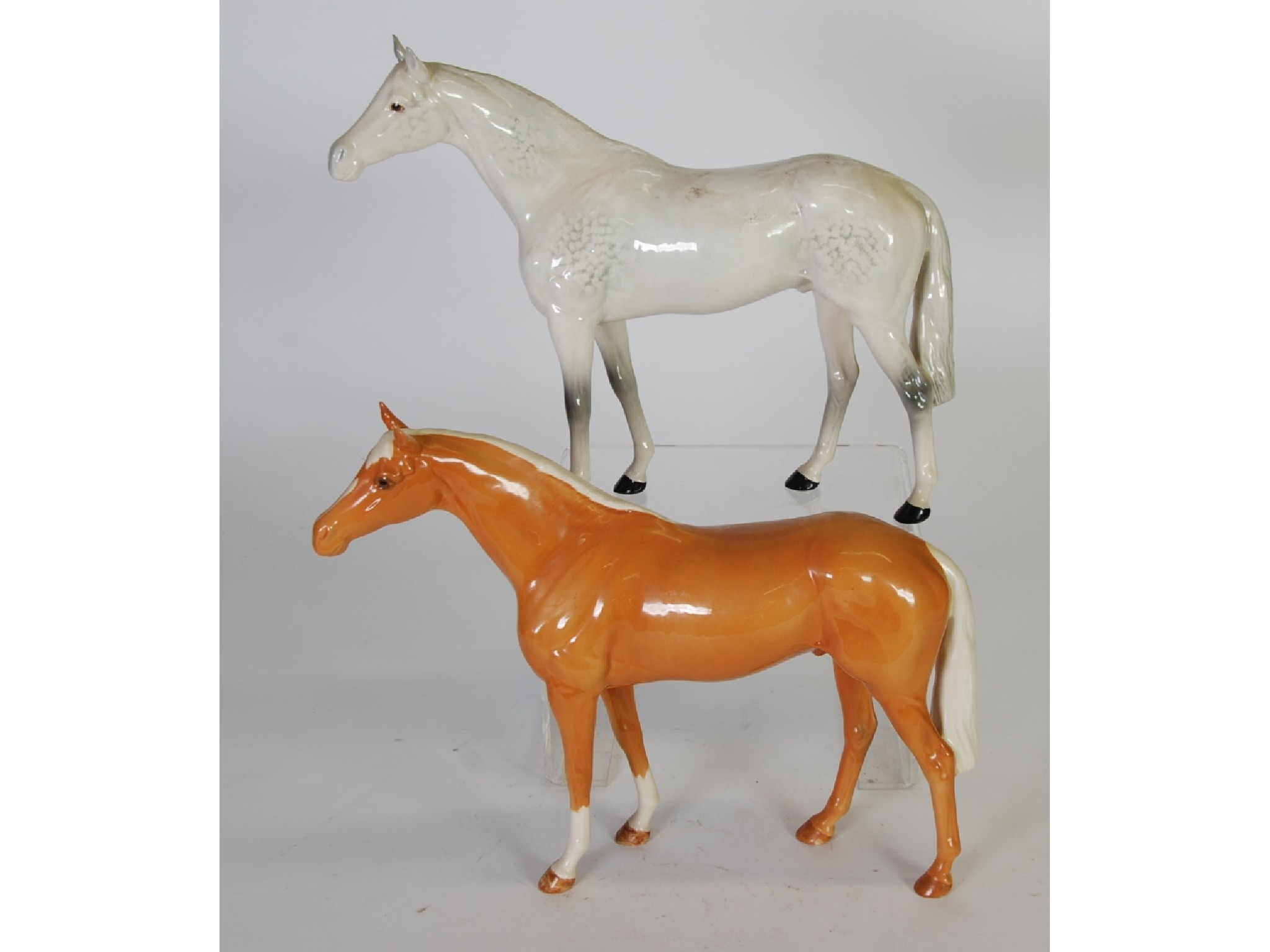 Appraisal: TWO BESWICK POTTERY MODELS OF LARGE RACEHORSES second versions grey