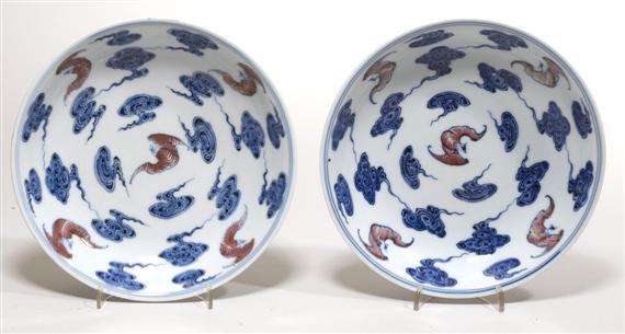 Appraisal: PAIR OF ROUND CUPS WITH BAT AND CLOUDS DECORATION China