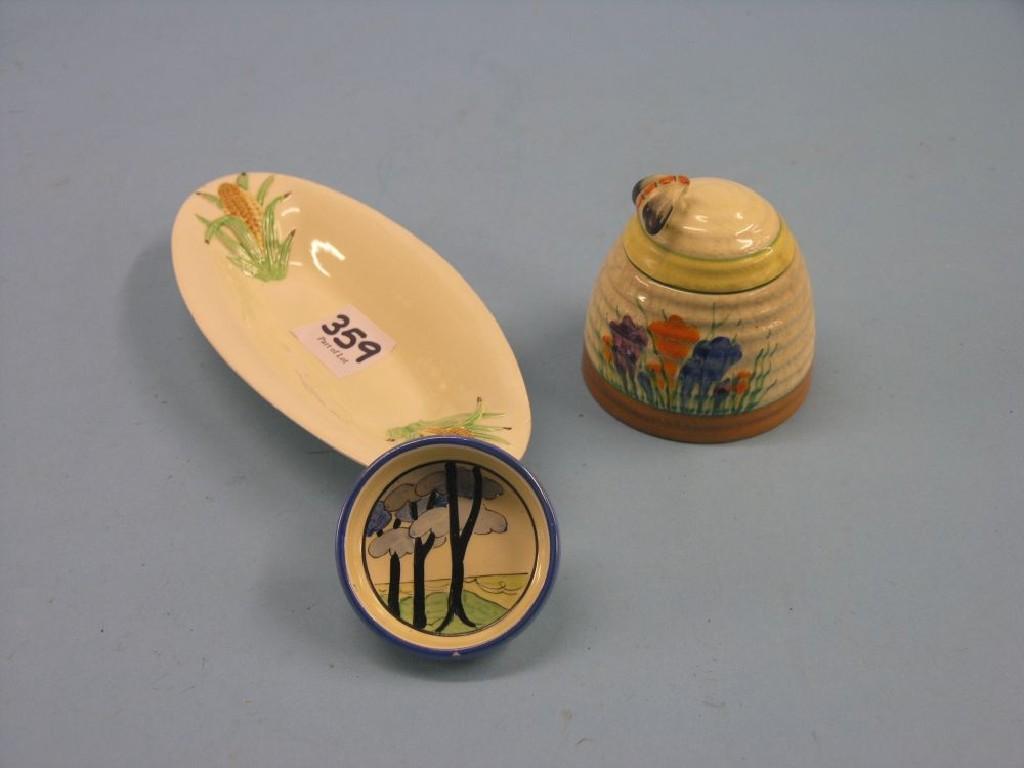 Appraisal: A Clarice Cliff honey pot Crocus pattern complete with cover