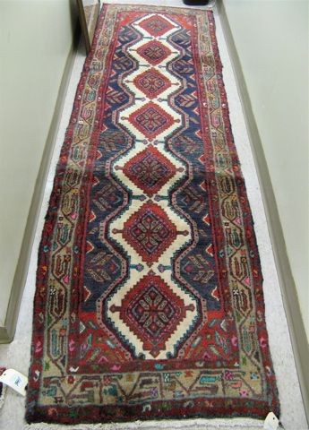 Appraisal: PERSIAN HAMADAN RUNNER repeating geometric medallion design on blue and