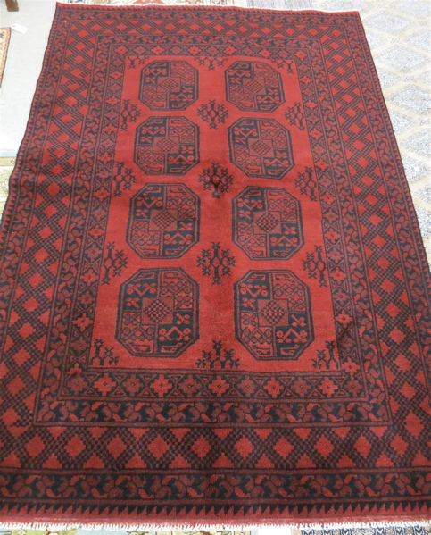 Appraisal: HAND KNOTTED ORIENTAL CARPET Afghan Ersari tribal the red field