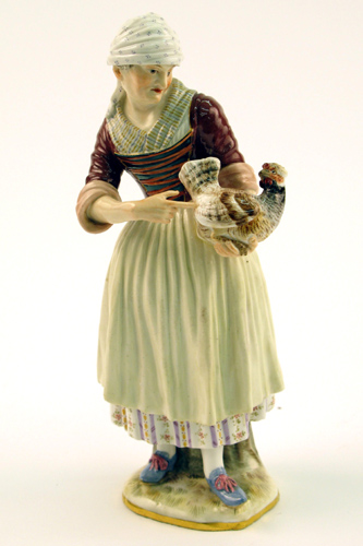 Appraisal: A MEISSEN GLAZED PORCELAIN FIGURE a female holding a chicken