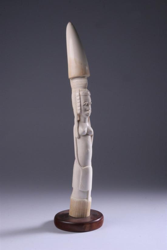 Appraisal: YORUBA ELEPHANT TUSK Nigeria th century Carved to depict figure