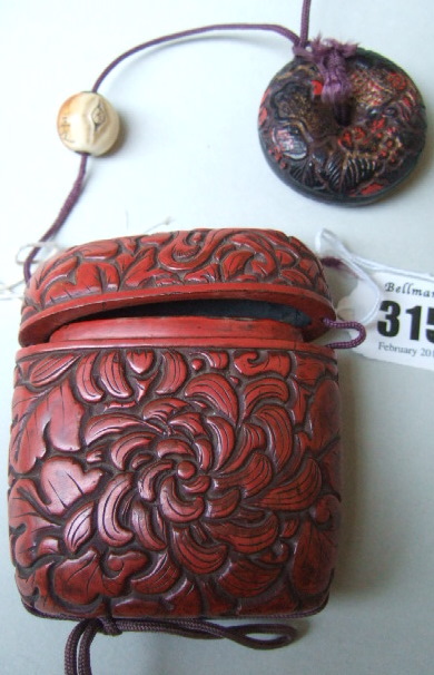 Appraisal: A red lacquer one-case inro th century of rounded square