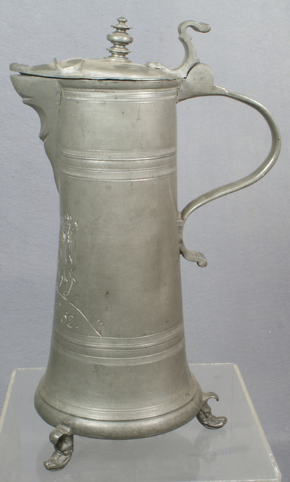 Appraisal: German pewter flagon tapered body coat of arms dated dolphin