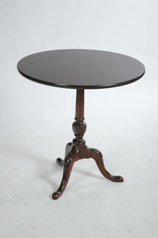 Appraisal: TEA TABLE Mahogany with a round top turned and carved