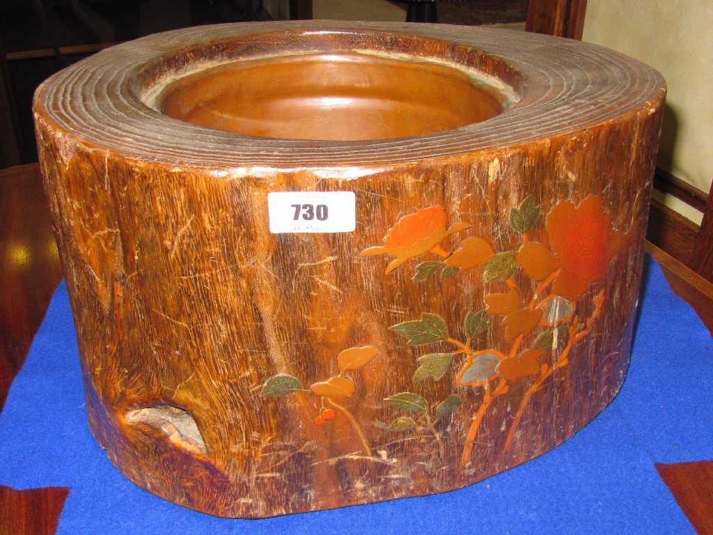 Appraisal: Planter modelled as a tree trunk with lacquered floral decoration