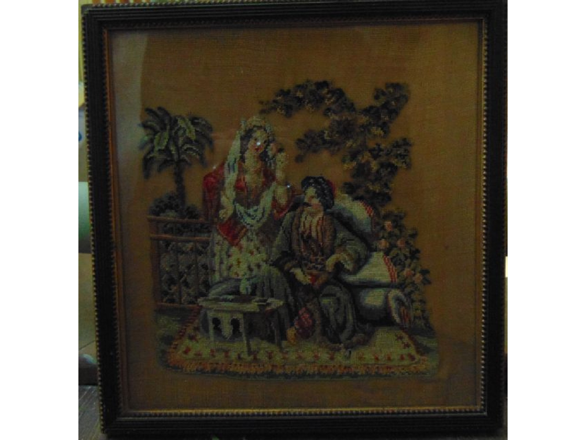 Appraisal: An early th century petit point panel showing a Turkish