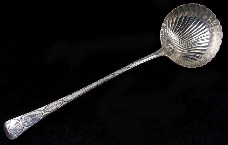 Appraisal: George III Sterling Punch Ladle with finely shaped shell bowl