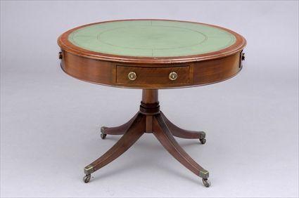 Appraisal: GEORGE III MAHOGANY DRUM-TOP TABLE The circular molded cross-banded top