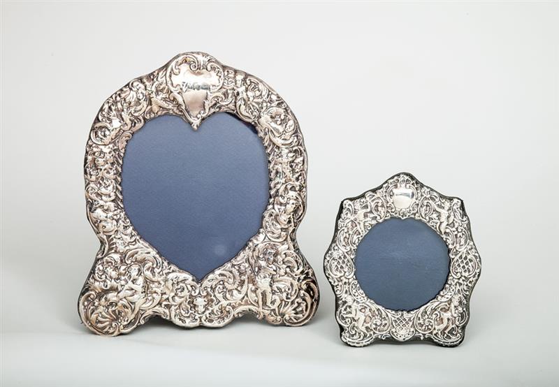 Appraisal: TWO ENGLISH SILVER-ON-VELVET PICTURE FRAMES MODERN London and x in