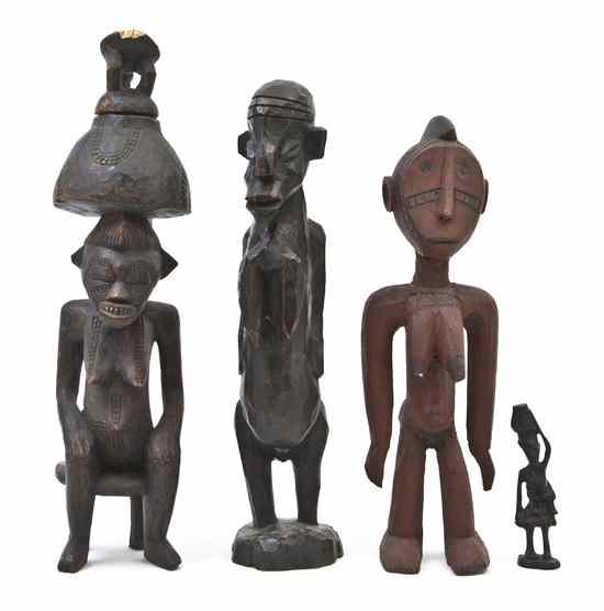 Appraisal: Four African Carved Figures each depicting a standing female one