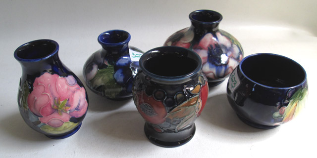 Appraisal: FIVE MOORCROFT POTTERY VASES hand painted under glaze in various