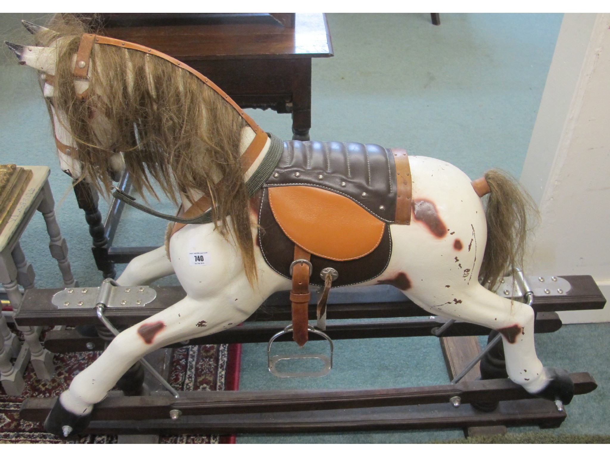 Appraisal: A contemporary wooden rocking horse ft tall