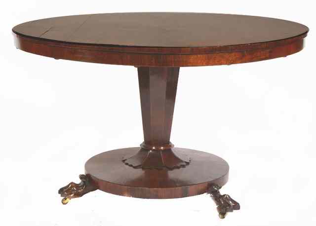 Appraisal: A REGENCY CIRCULAR MAHOGANY DINING TABLE the tilting top over