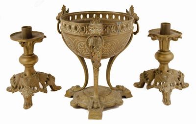 Appraisal: A pair of gilt bronze candlesticks raised on pierced triform