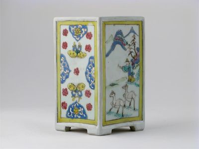 Appraisal: A Chinese famille rose square brushpot decorated with panels of