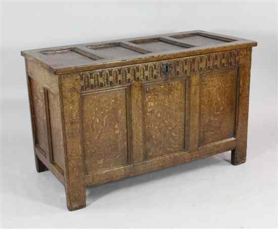 Appraisal: A late th century oak coffer with panelled top on