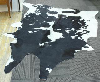 Appraisal: Vintage Cowhide Rug Tanned cowhide the supple rug with attractively